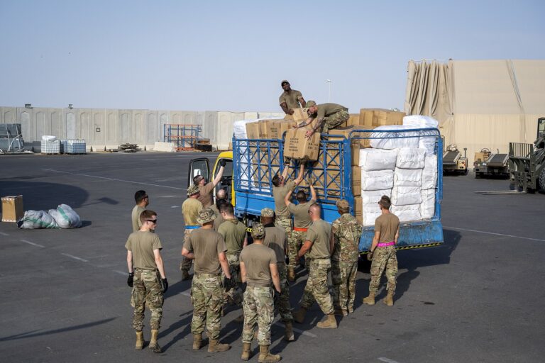 U.S. Air Force Airman from the 380th Expeditionary Contracting Squadron, 380th Expeditionary Logistics Readiness Squadron, and the 380th Expeditionary Civil Engineer Squadron gathe