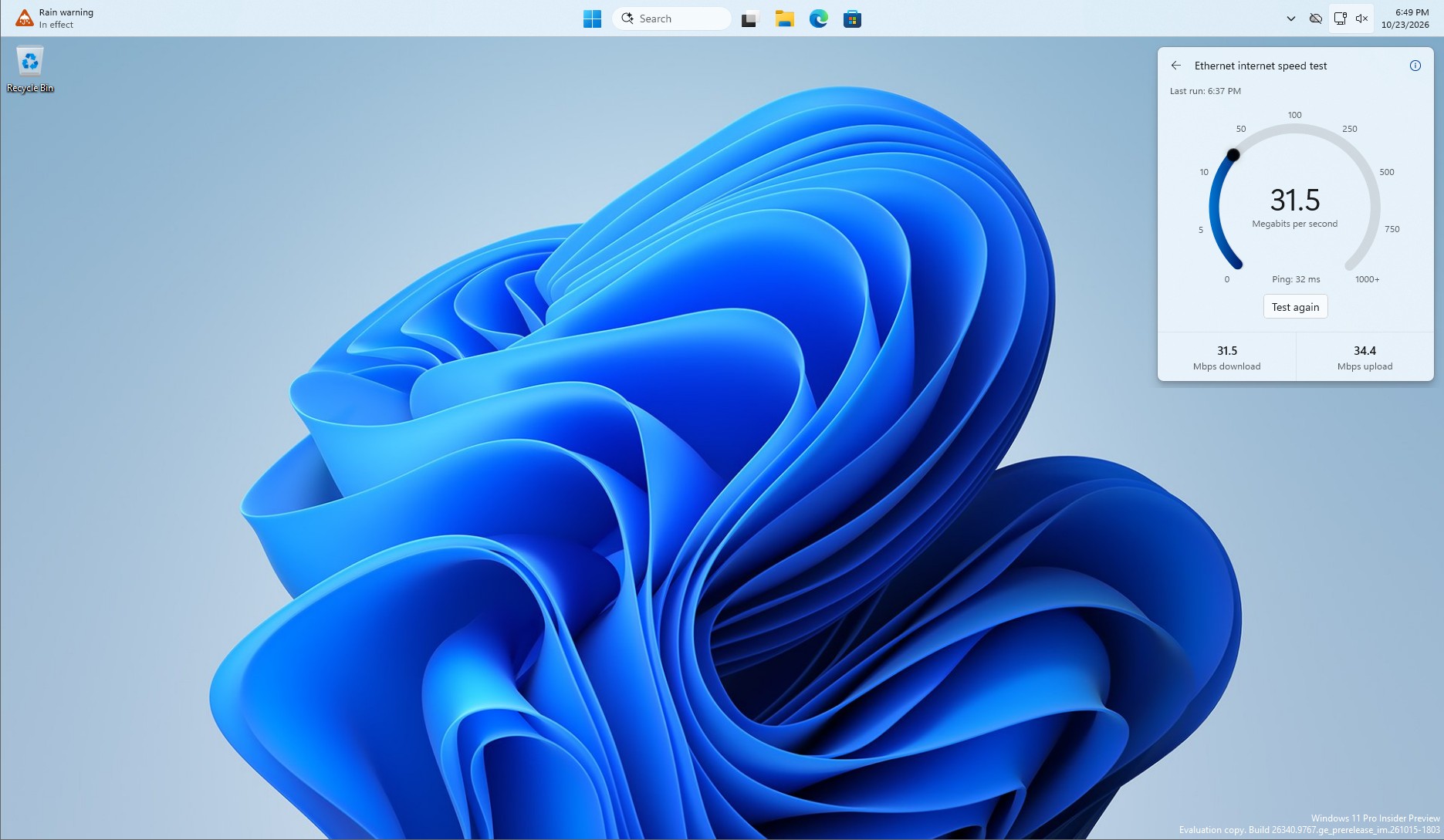 New-Internet-Speed-Test-feature-in-Windows-11-on-a-top-positioned-taskbar.jpg