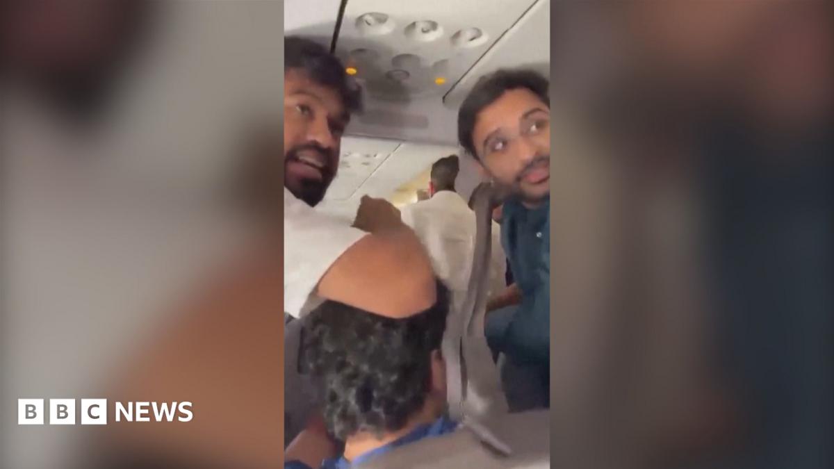Phone video of people in panic on a plane.