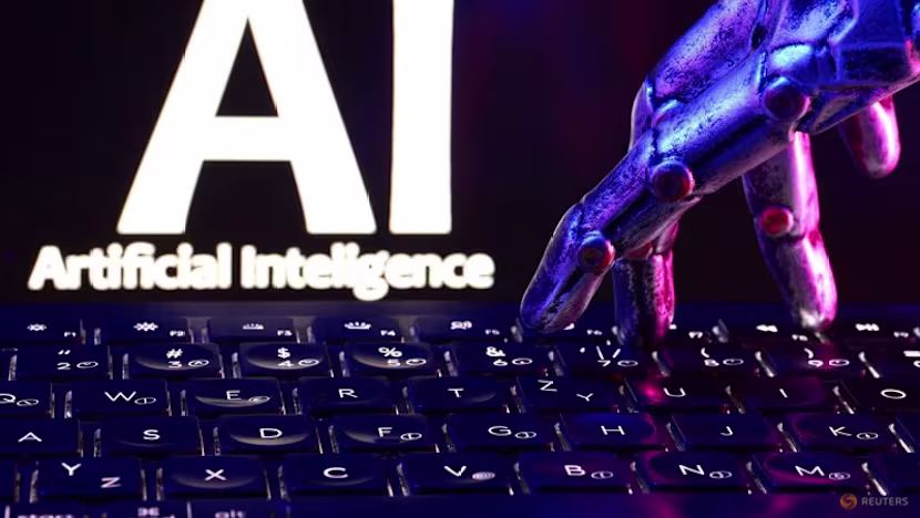 "AI Artificial Intelligence" words, a keyboard and a robotics hand in this illustration taken, September 23, 2026. REUTERS/Dado Ruvic/Illustration