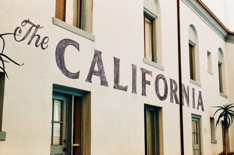 White building with "the california" painted on its side